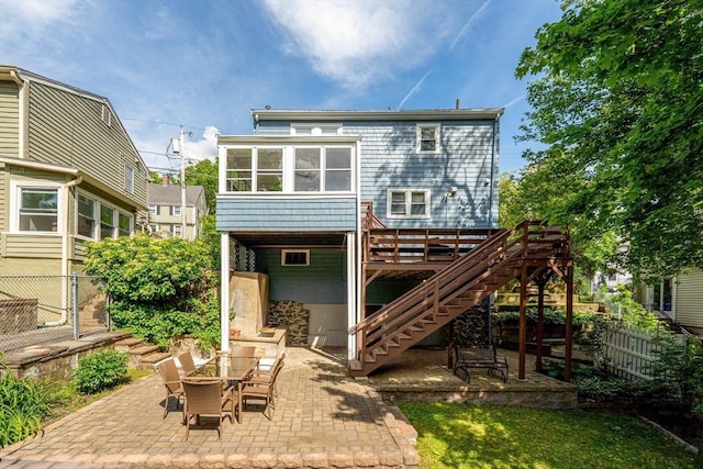 90 Woodland Rd, Malden, MA 02148 - back of house featuring a patio area, stairway, and a sunroom