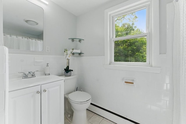 90 Woodland Rd, Malden, MA 02148 - bathroom featuring vanity, tile walls, tile patterned floors, toilet, and a baseboard radiator