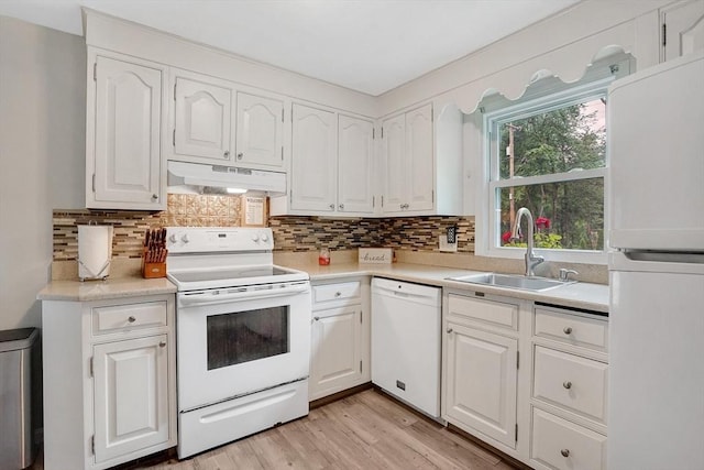 389 Porter Rd, East Longmeadow, MA 01028 - kitchen featuring white appliances, under cabinet range hood, white cabinetry, and light countertops