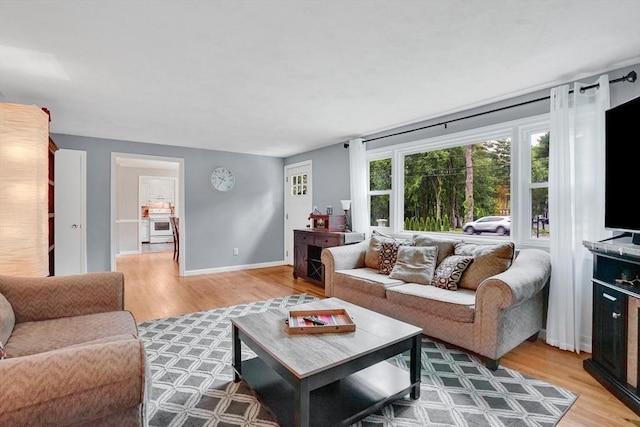 389 Porter Rd, East Longmeadow, MA 01028 - living area featuring light wood-style floors and baseboards