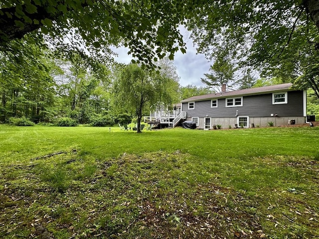 389 Porter Rd, East Longmeadow, MA 01028 - view of green lawn with a wooden deck