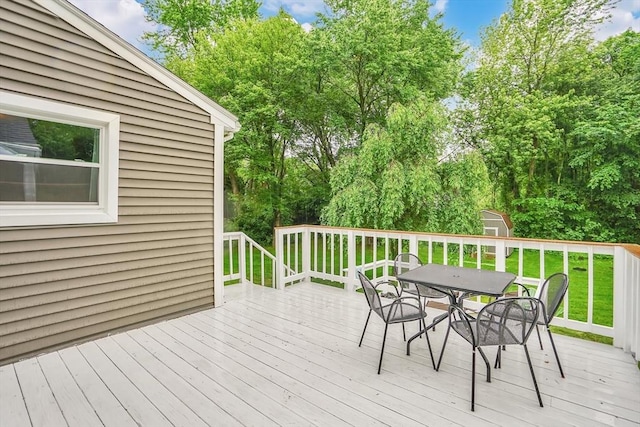 389 Porter Rd, East Longmeadow, MA 01028 - wooden terrace with outdoor dining space, a storage shed, and a lawn