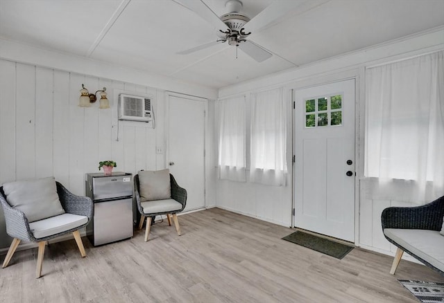 389 Porter Rd, East Longmeadow, MA 01028 - foyer with light wood-type flooring, an AC wall unit, and a ceiling fan