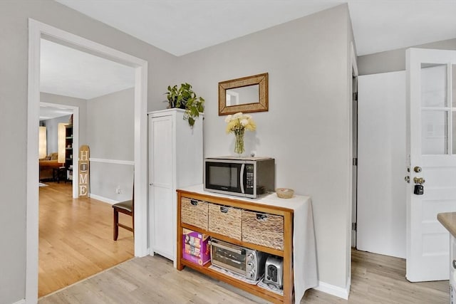 389 Porter Rd, East Longmeadow, MA 01028 - hallway with light wood finished floors and baseboards