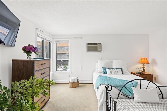 carpeted bedroom featuring a wall unit AC and a baseboard heating unit