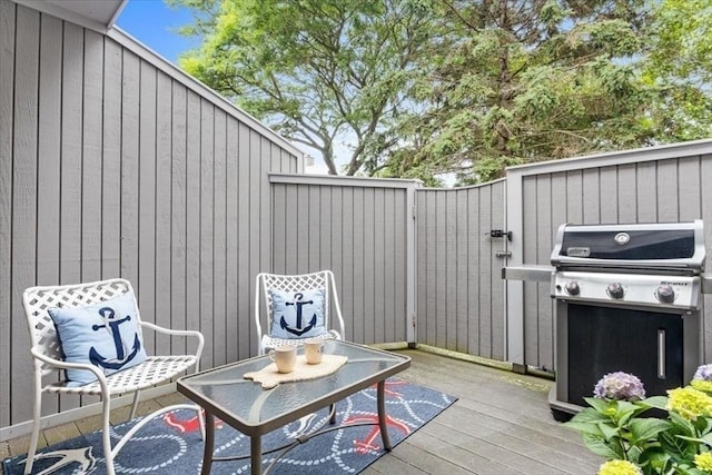 wooden deck featuring grilling area