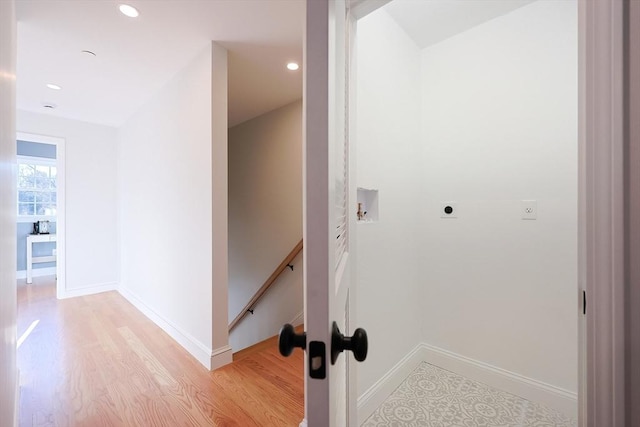 hall with light hardwood / wood-style floors