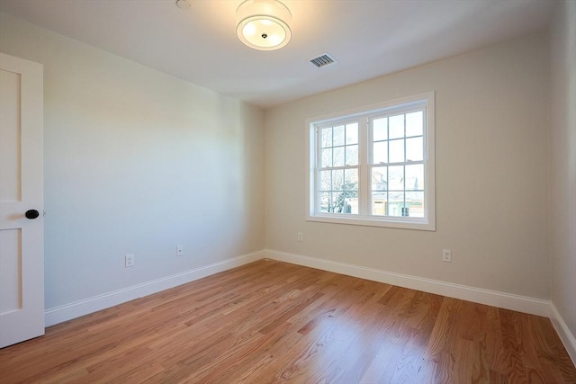 empty room with light hardwood / wood-style floors