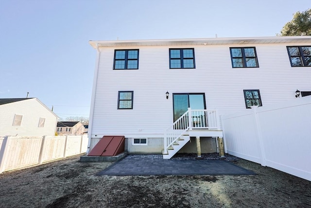 rear view of property featuring a patio area