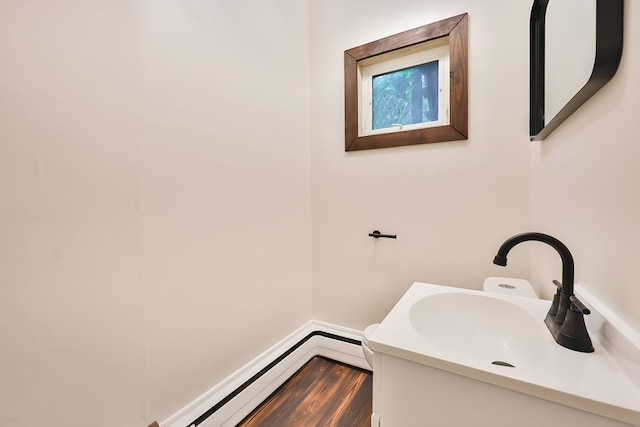 bathroom featuring hardwood / wood-style flooring and sink