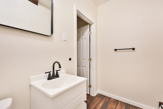 bathroom featuring vanity and hardwood / wood-style flooring