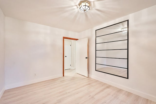 empty room with light wood-type flooring