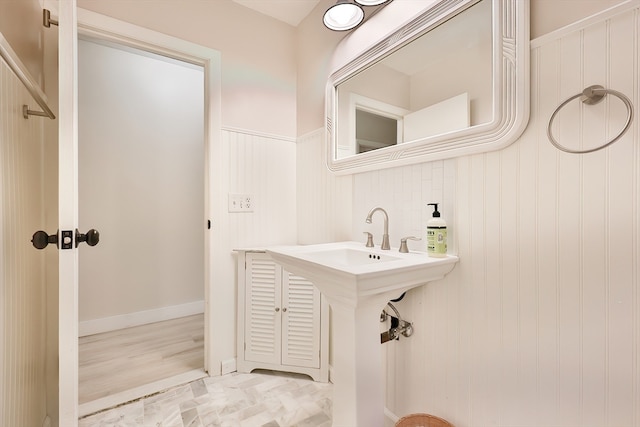 bathroom with hardwood / wood-style flooring