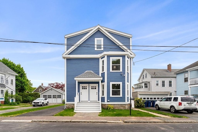 28 Fairmount St Unit 1, Salem, MA 01970 - view of front facade featuring a garage and driveway