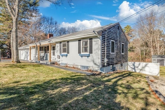 ranch-style home featuring a front yard and a porch