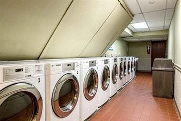 clothes washing area featuring washer and dryer