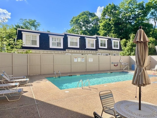 view of swimming pool featuring a patio area