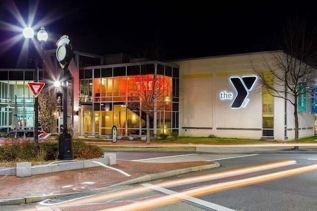 view of exterior entry at twilight