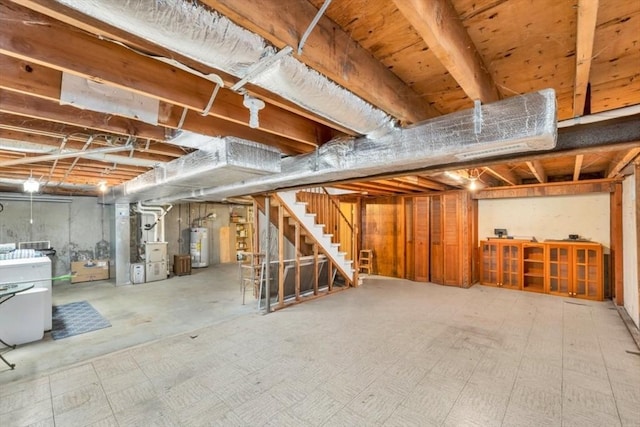 basement with water heater and heating unit