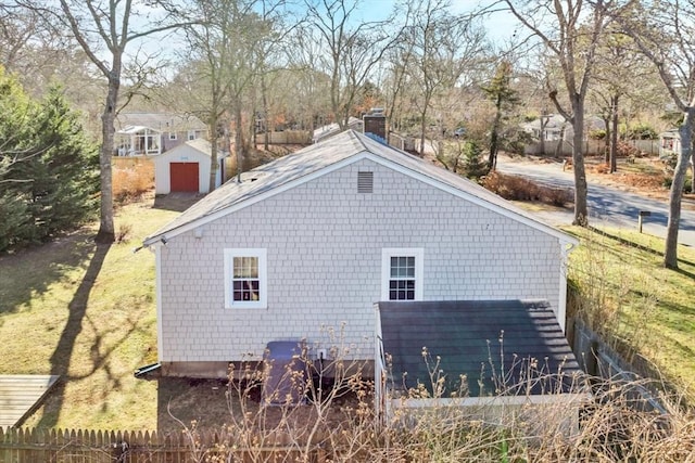 view of home's exterior with a shed