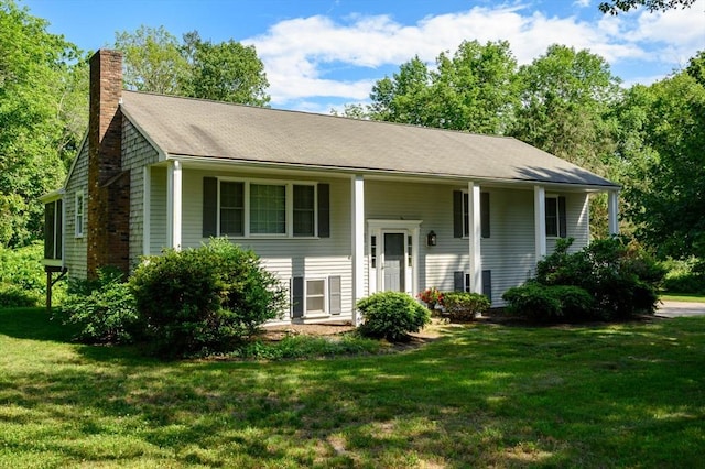 11 Williamsburg Ln, Scituate, MA 02066 - split foyer home with a chimney and a front lawn