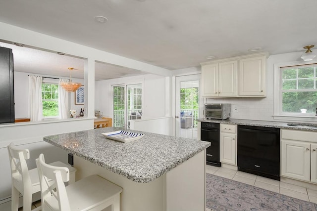 11 Williamsburg Ln, Scituate, MA 02066 - kitchen featuring dishwasher, light stone countertops, backsplash, and light tile patterned flooring