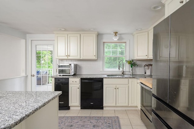 11 Williamsburg Ln, Scituate, MA 02066 - kitchen with stainless steel appliances, light tile patterned floors, backsplash, light stone counters, and recessed lighting