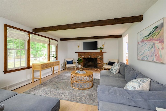 11 Williamsburg Ln, Scituate, MA 02066 - living room with wood finished floors, beamed ceiling, and a fireplace