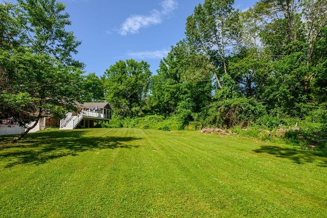 11 Williamsburg Ln, Scituate, MA 02066 - view of grassy yard with stairway and a wooden deck