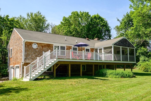 11 Williamsburg Ln, Scituate, MA 02066 - back of property with a sunroom, a deck, a yard, stairway, and a garage