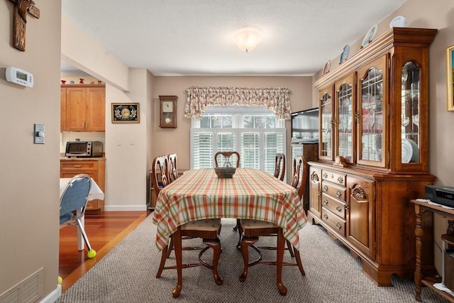 84 Chapin Greene Unit 84, Ludlow, MA 01056 - dining space with wood finished floors and baseboards