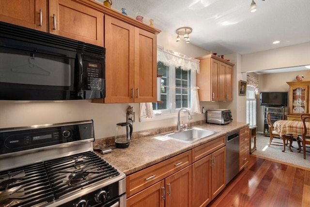 84 Chapin Greene Unit 84, Ludlow, MA 01056 - kitchen featuring appliances with stainless steel finishes, dark wood finished floors, healthy amount of natural light, and brown cabinetry