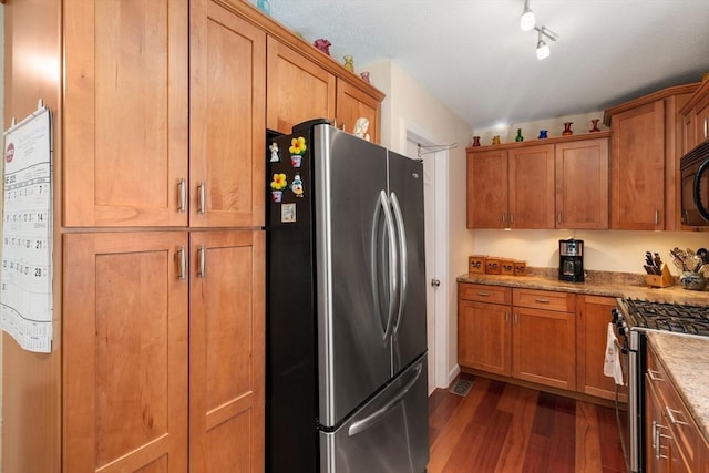84 Chapin Greene Unit 84, Ludlow, MA 01056 - kitchen featuring appliances with stainless steel finishes, dark wood-type flooring, and brown cabinets