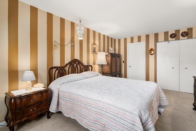 84 Chapin Greene Unit 84, Ludlow, MA 01056 - bedroom with light carpet, wallpapered walls, and a closet