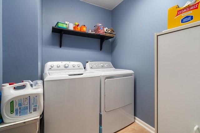84 Chapin Greene Unit 84, Ludlow, MA 01056 - laundry room with washing machine and dryer and light wood-style floors
