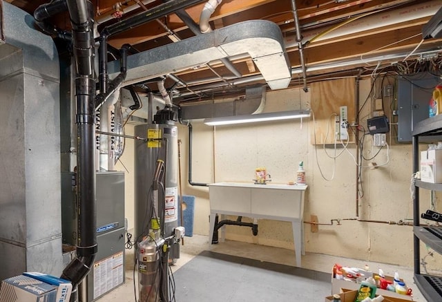 84 Chapin Greene Unit 84, Ludlow, MA 01056 - unfinished basement with strapped water heater and electric panel