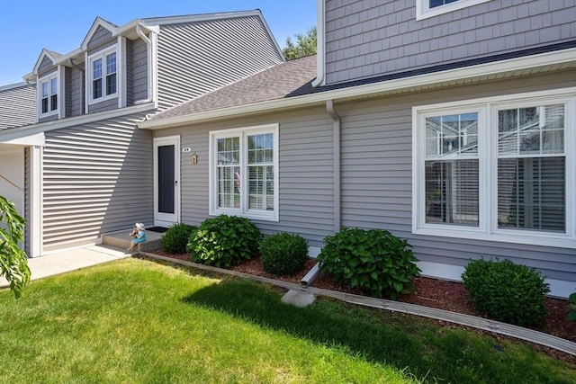 84 Chapin Greene Unit 84, Ludlow, MA 01056 - view of front facade featuring a front yard and roof with shingles