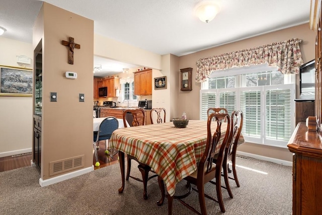 84 Chapin Greene Unit 84, Ludlow, MA 01056 - dining room featuring carpet floors and healthy amount of natural light
