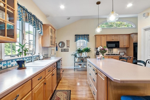 4 Pleasant View St, Methuen, MA 01844 - kitchen with black microwave, a sink, light countertops, healthy amount of natural light, and lofted ceiling