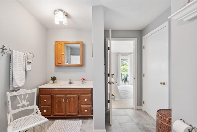 4 Pleasant View St, Methuen, MA 01844 - bathroom with vanity, tile patterned floors, and baseboards
