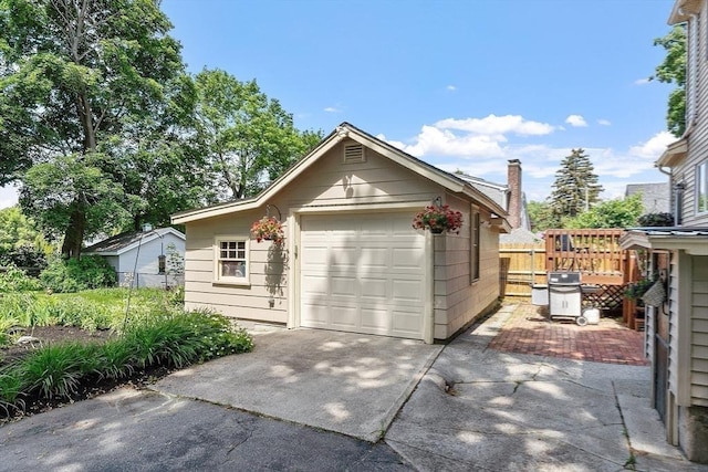 4 Pleasant View St, Methuen, MA 01844 - view of front of home with concrete driveway, a detached garage, and an outbuilding