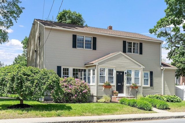 4 Pleasant View St, Methuen, MA 01844 - view of front facade with a chimney and a front yard