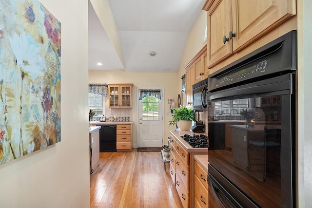 4 Pleasant View St, Methuen, MA 01844 - kitchen featuring black appliances, light wood finished floors, lofted ceiling, glass insert cabinets, and recessed lighting