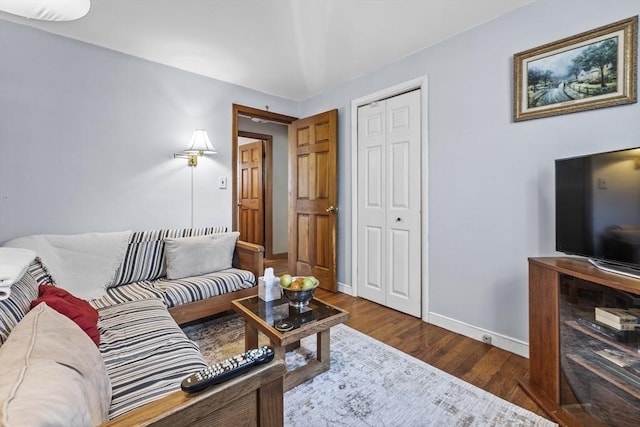 living room with baseboards and wood finished floors