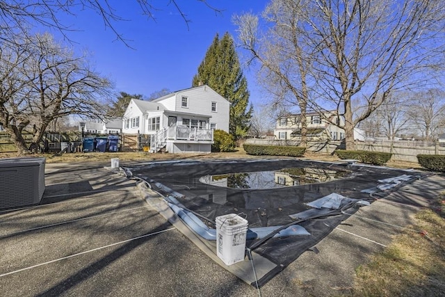 exterior space featuring fence and a fenced in pool