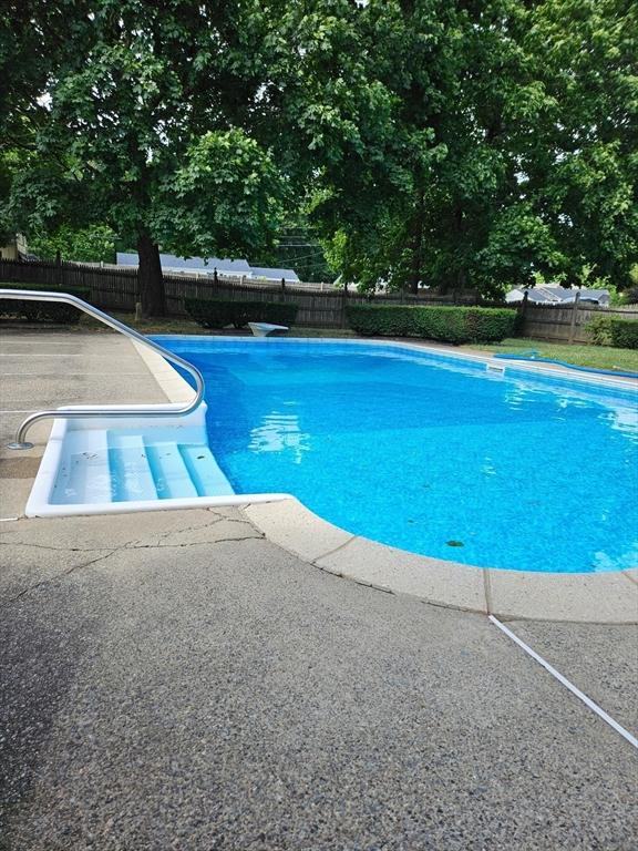 view of pool featuring a patio area, a fenced in pool, and fence