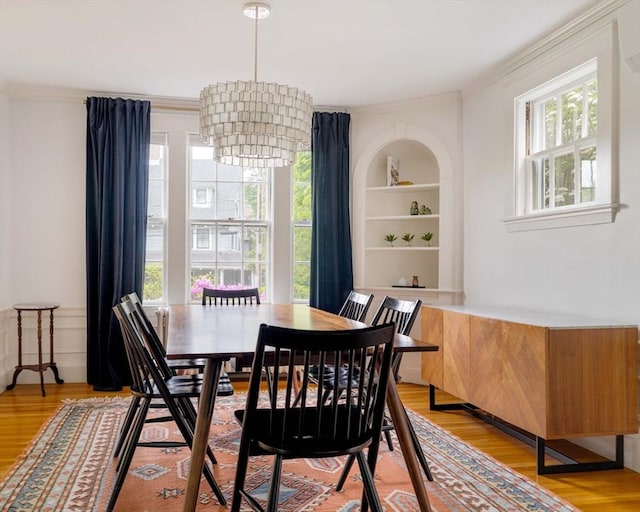 96 Nonantum St, Newton, MA 02458 - dining room with ornamental molding, plenty of natural light, light wood-style flooring, and built in features
