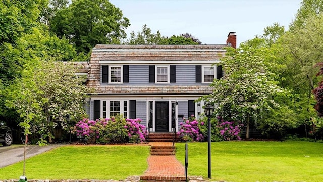 96 Nonantum St, Newton, MA 02458 - view of front of house with a chimney and a front lawn