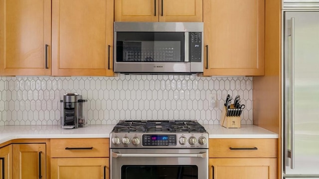 96 Nonantum St, Newton, MA 02458 - kitchen featuring stainless steel appliances, light countertops, and backsplash