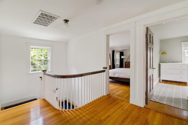 96 Nonantum St, Newton, MA 02458 - hall featuring an upstairs landing, wood finished floors, and a baseboard radiator